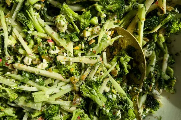 Whole Broccoli Slaw with Golden Raisins, Feta, Toasted Pistachios, and Herbs