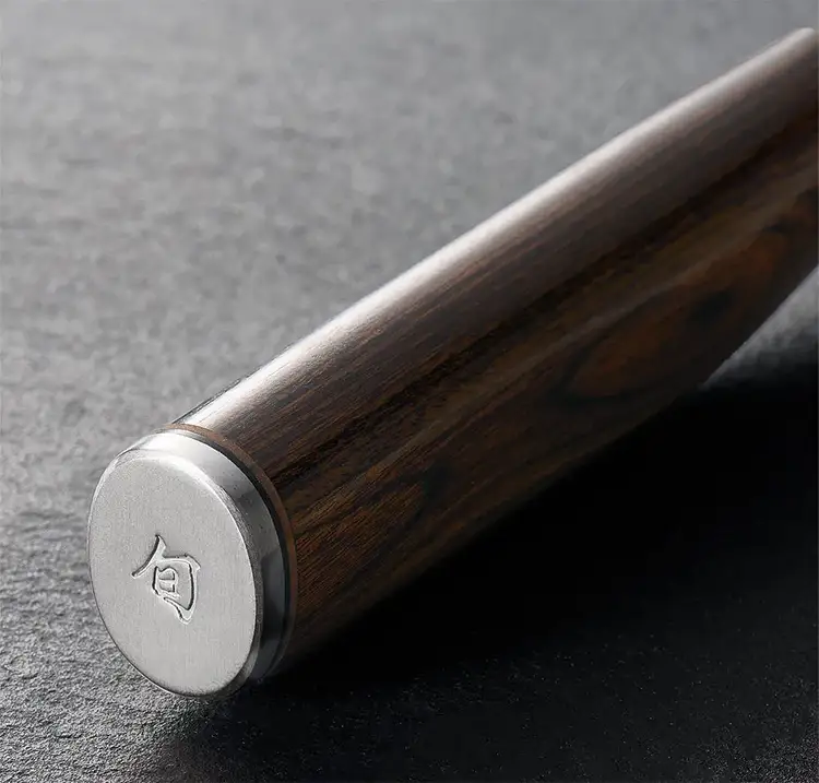 Close up image of the stainless steel endcap of a Premier knife.