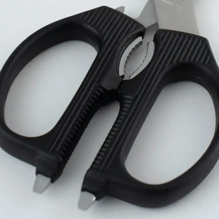 Close-up of Shun Multipurpose Shears handles showing the nutcracker and integrated tool features.