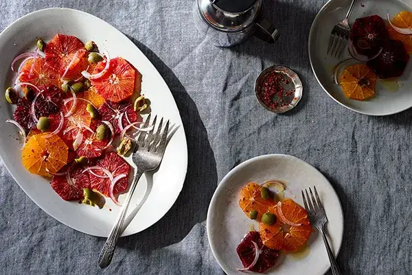 Sliced oranges and clementines on a plate