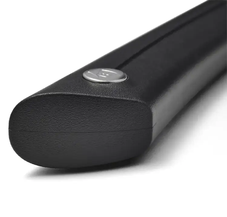 Close-up of the textured molded handle on the Shun Sora Knife, showing the end cap detail and ergonomic design for grip and control.