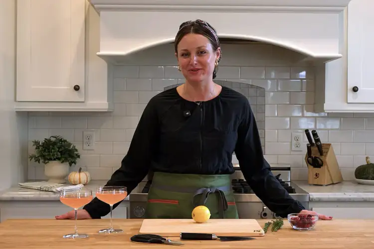 Andrea Slonecker prepares a garnish for a holiday cocktail.