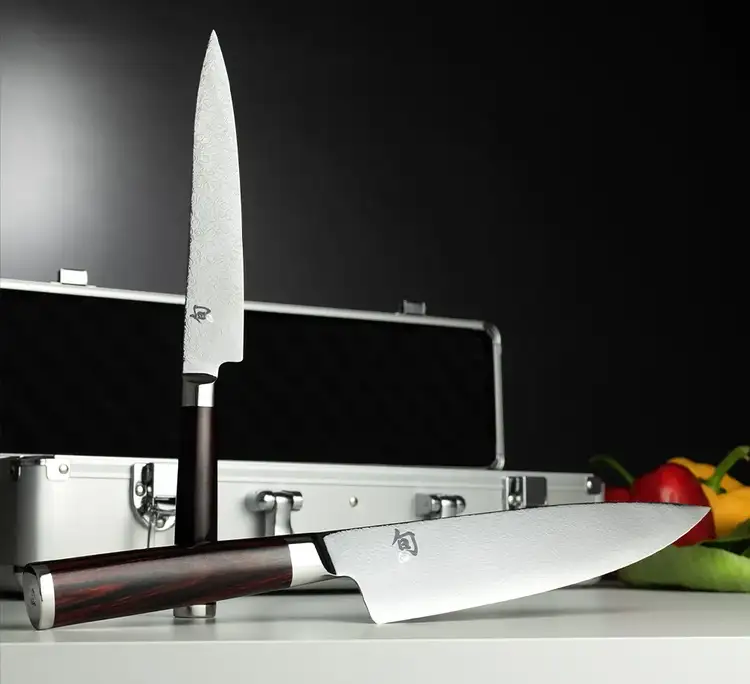 Image of the Kohen Knife set propped on a table in front of its carrying case. Click to shop the Kohen Set.