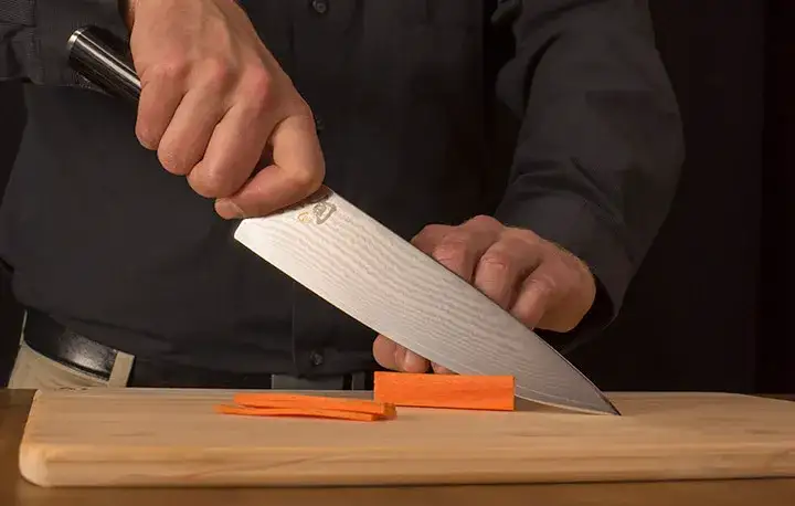 Shun Chef's knife slicing carrots