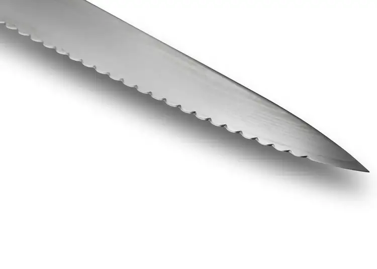 Close-up of the Classic Offset Bread Knife with scalloped serrations for clean slicing.