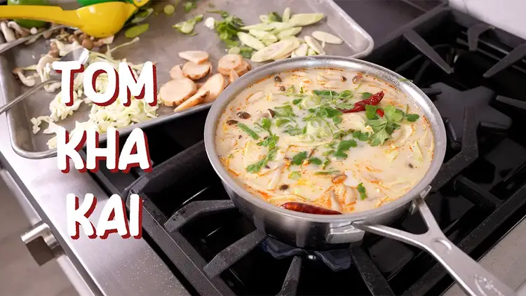 Coconut chicken soup in a pot on stove top