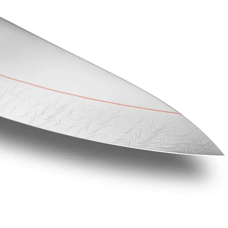 Macro view of the Shun Kagerou Chef’s Knife tip highlighting the fine Damascus steel pattern and precision-sharpened 16-degree edge.