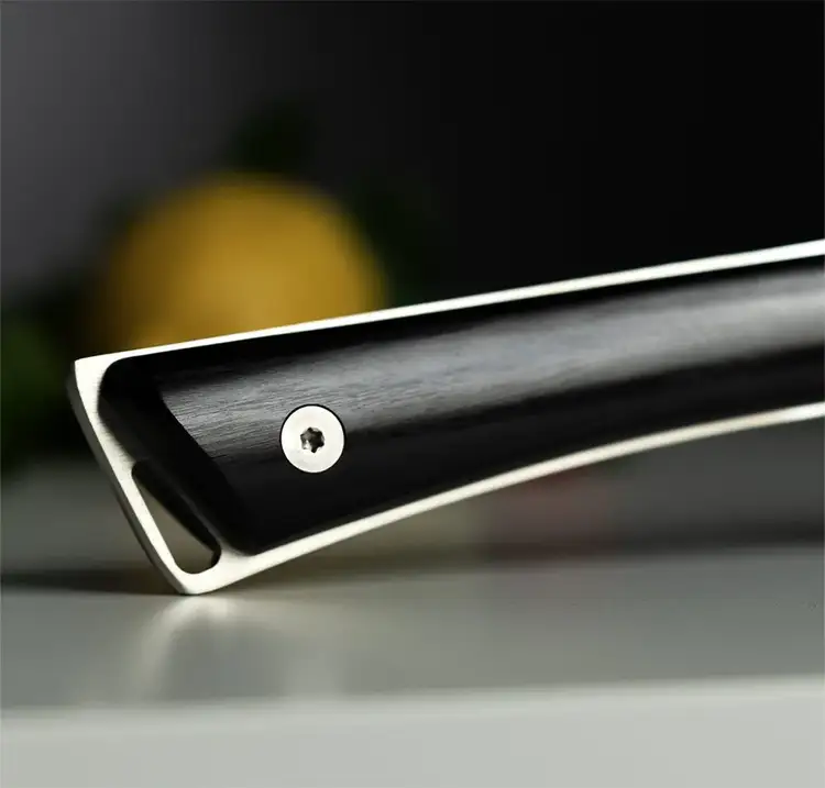 Detailed image of Kazahana knife’s polished pakkawood handle and exposed tang—showing durability, comfort, and refined finish.