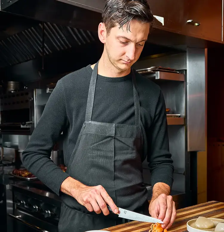 Chef Nate Hobart slices a vibrant havanada pepper using the Shun Dual Core 6” Utility Knife. Click to read his interview.