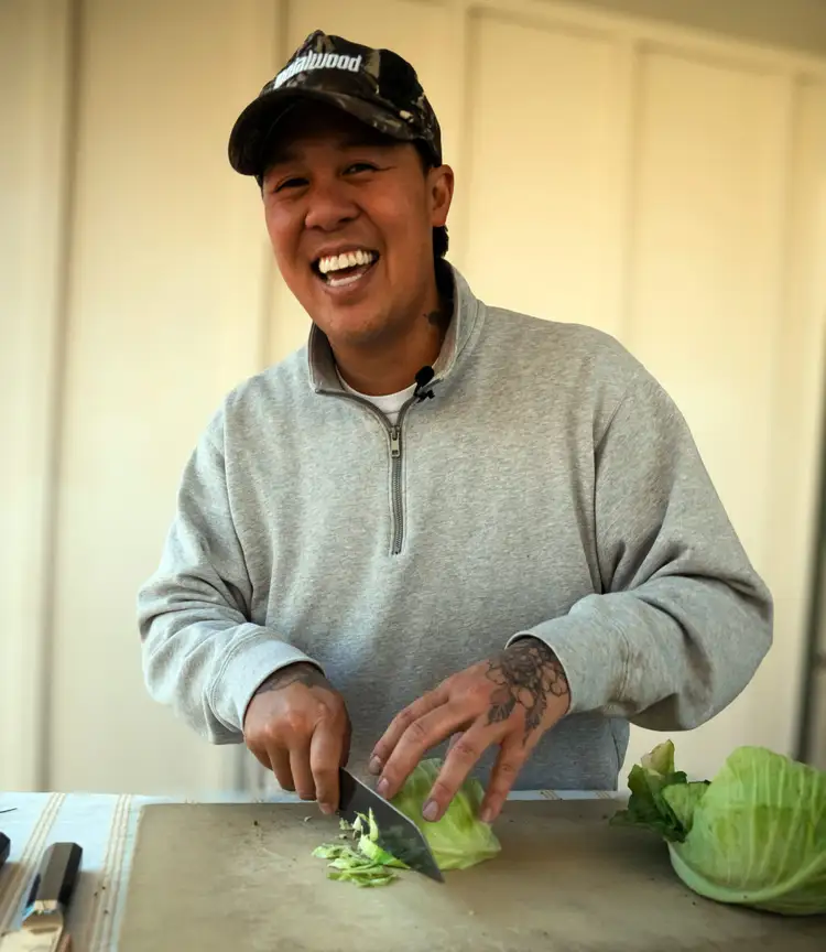 Chef Ni Nguyen slices cabbage with a Dual Core kiritsuke.