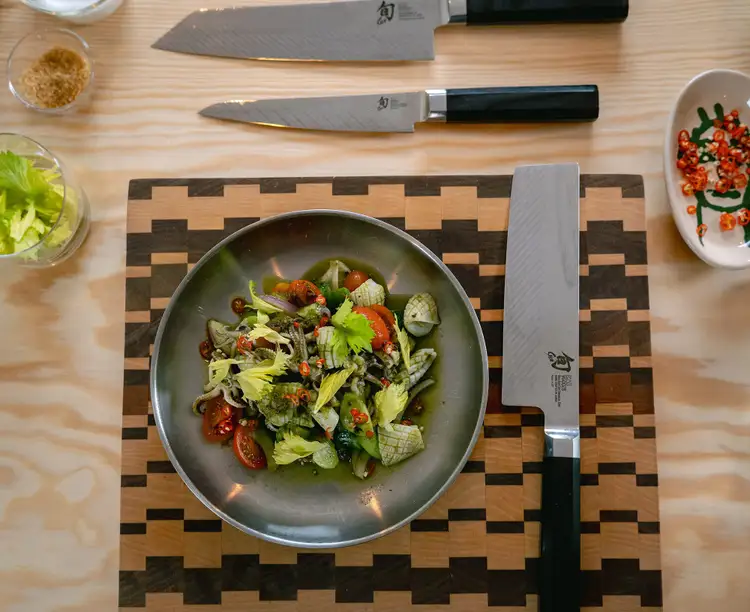 Chef Morelli's squid salad, next to a group of Shun Dual Core knives.