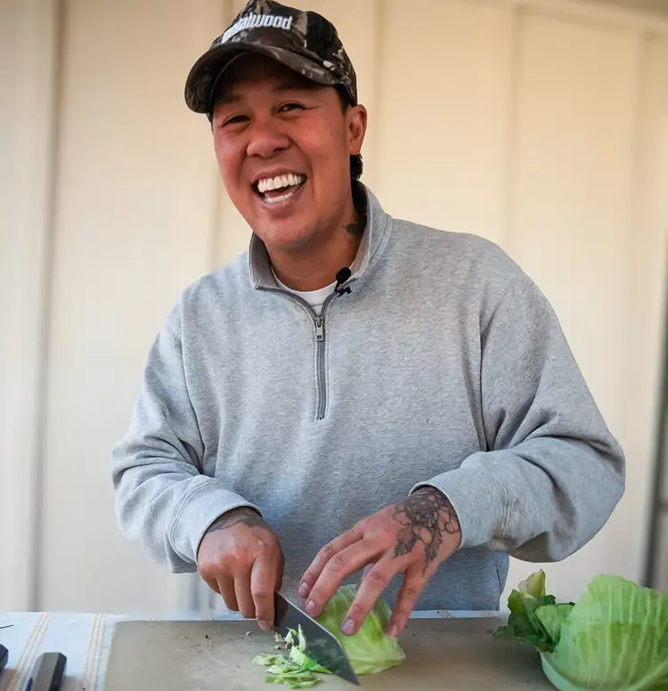 Chef Ni Nguyen slices cabbage with a Shun Dual Core Kiritsuke. Click to read his interview.