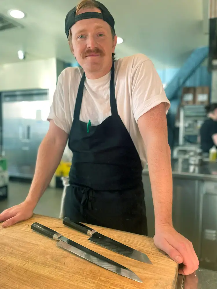 Chef Mike Conrad stands in his kitchen at Restaurant Lena in Detroit.