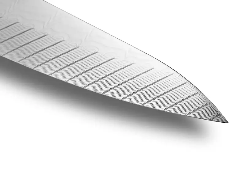 Close-up of a Shun knife blade showing refined edge geometry and layered Japanese steel craftsmanship.