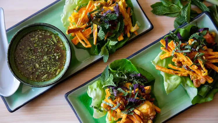Vietnamese Sweet Potato and Shrimp Fritters on plates with dipping sauce
