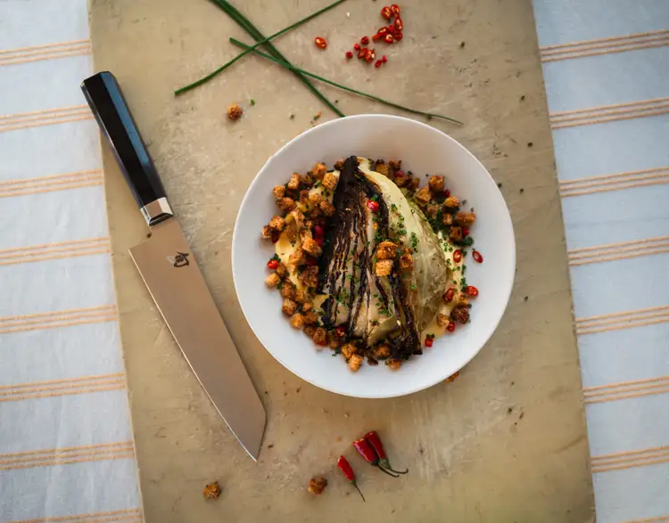 Chef Nguyen's bắp cải luộc, next to a Shun Dual Core Kiritsuke.