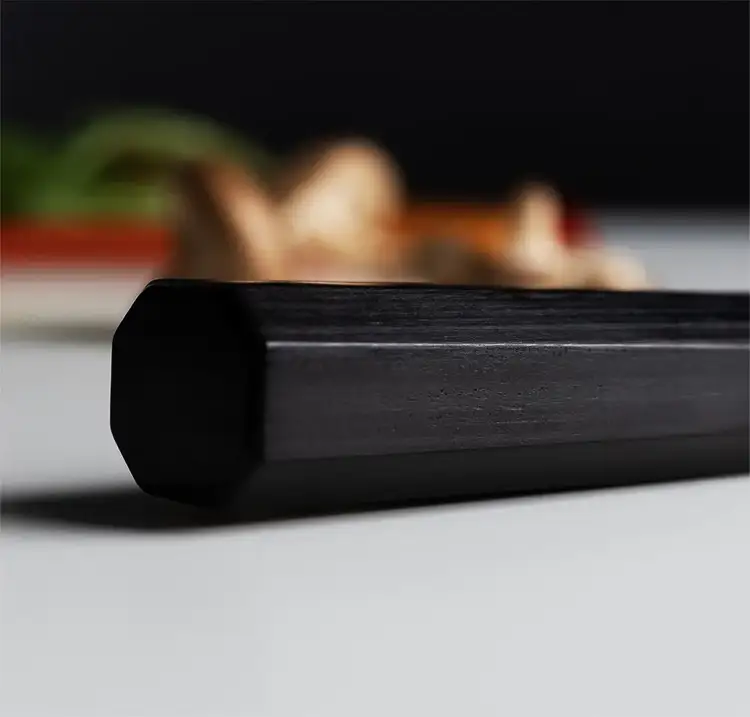 A close up of the octagonal Pakkawood handle of a Dual Core knife.