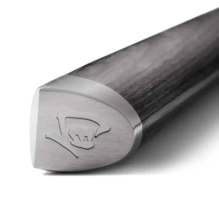 Detailed view of the Shun Kagerou handle endcap featuring the Shun logo engraved in brushed stainless steel and dark, contoured wood grain.