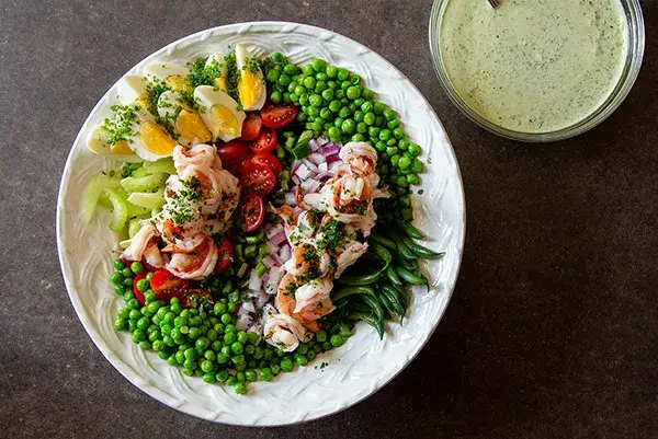 Chopped Salad in a bowl with dressing